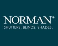 Showing Norman Shutters Blinds Shades logo in white on dark background