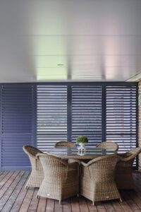 Showing outdoor aluminium plantation shutters in an alfresco area, providing privacy, shade and weather protection with a modern finish.