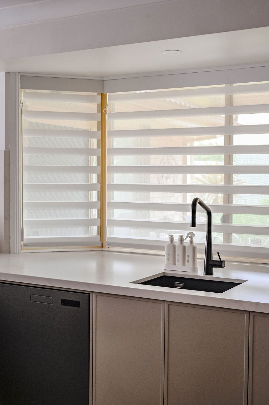 Showing PerfectSheer blinds across kitchen corner windows, providing filtered natural light, privacy and a clean modern finish.