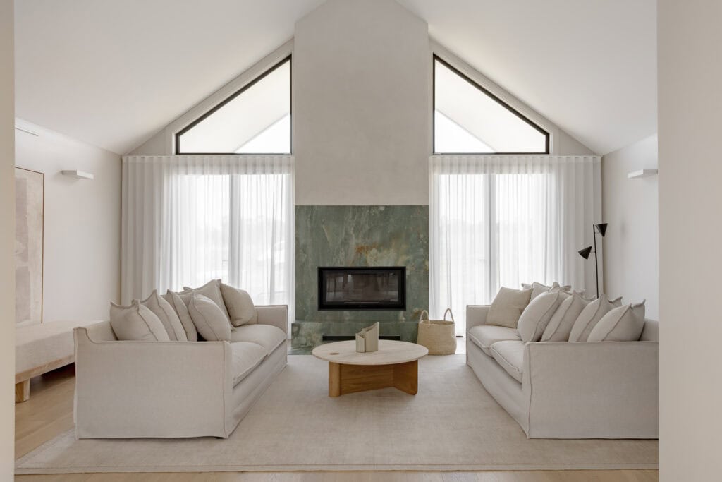 Showing floor-to-ceiling sheer curtains in a modern living room, filtering natural light and creating a bright, private and welcoming space.