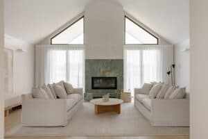 Showing floor-to-ceiling sheer curtains in a modern living room, filtering natural light and creating a bright, private and welcoming space.