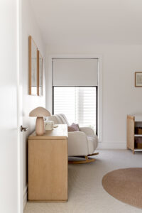 Showing a motorised roller blind in a modern nursery, providing privacy, light control and a calm, comfortable space for rest.
