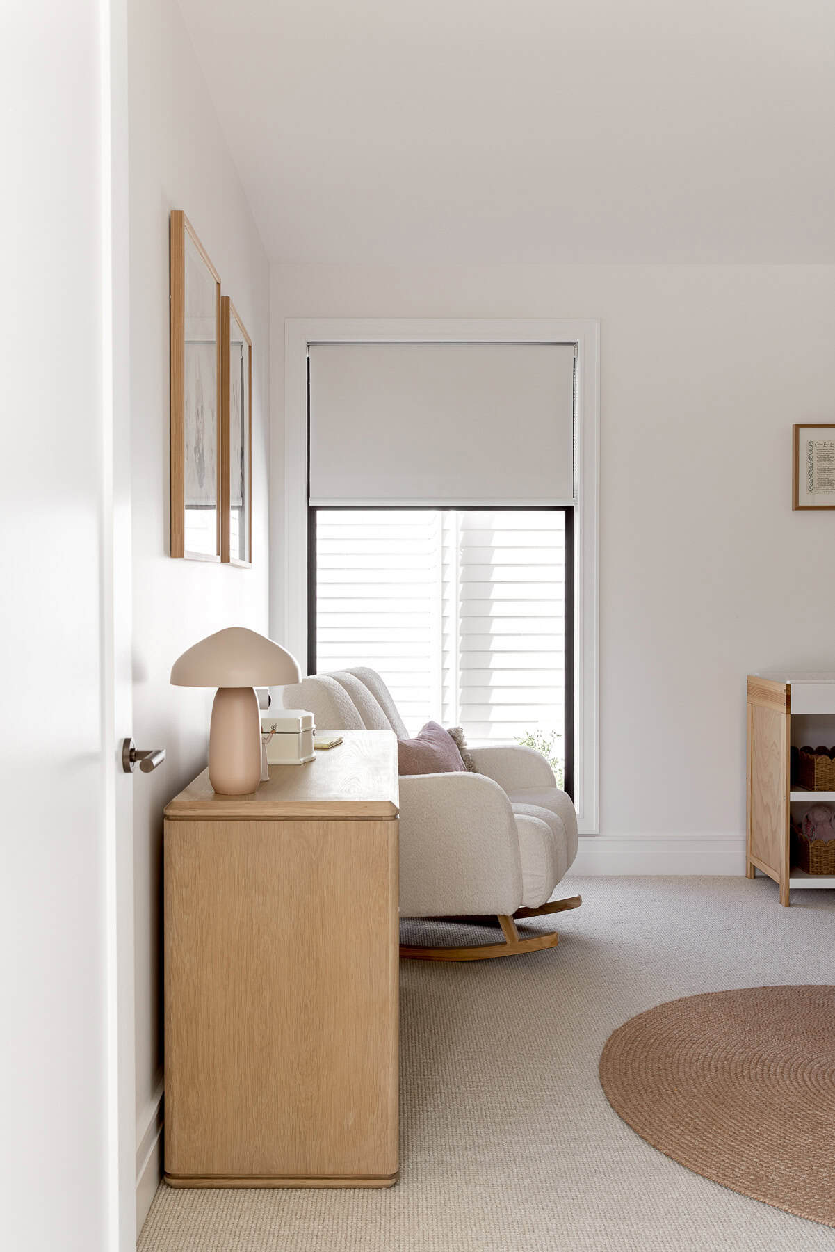 Showing a motorised roller blind in a modern nursery, providing privacy, light control and a calm, comfortable space for rest.